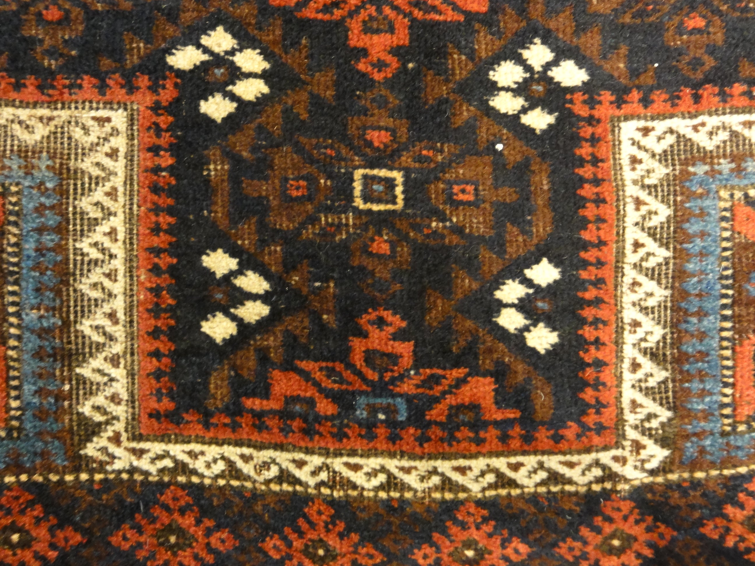 An antique and original burial Baluch dated rug. Dated on all four corners. Used as a casket covering. Sold by Santa Barbara Design Center.