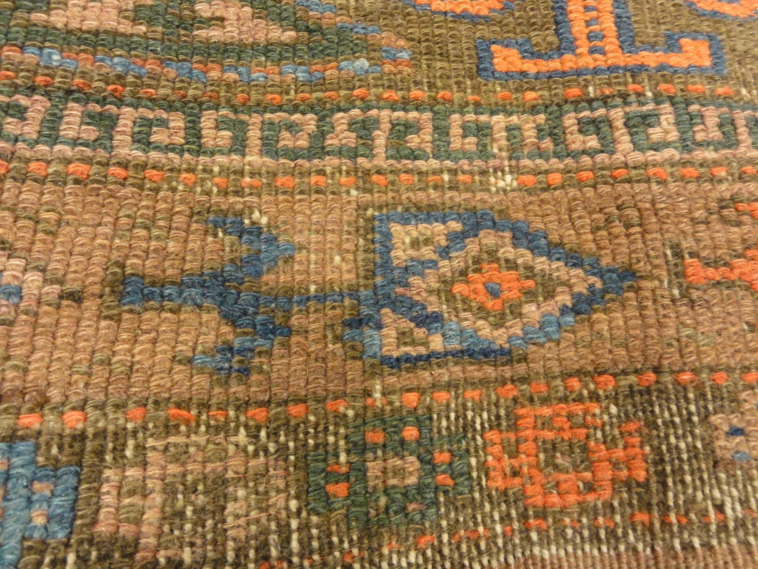 An antique original Mushwani Baluch rug handwoven in Afghanistan. A piece of genuine, authentic woven carpet art. Sold by Santa Barbara Design Center.