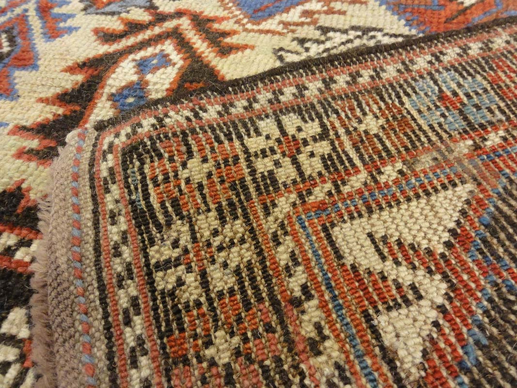 Antique Caucasian Shirvan Botteh Motif. Antique piece of woven carpet art sold by the Santa Barbara Design Center, Rugs and More in Santa Barbara, CA