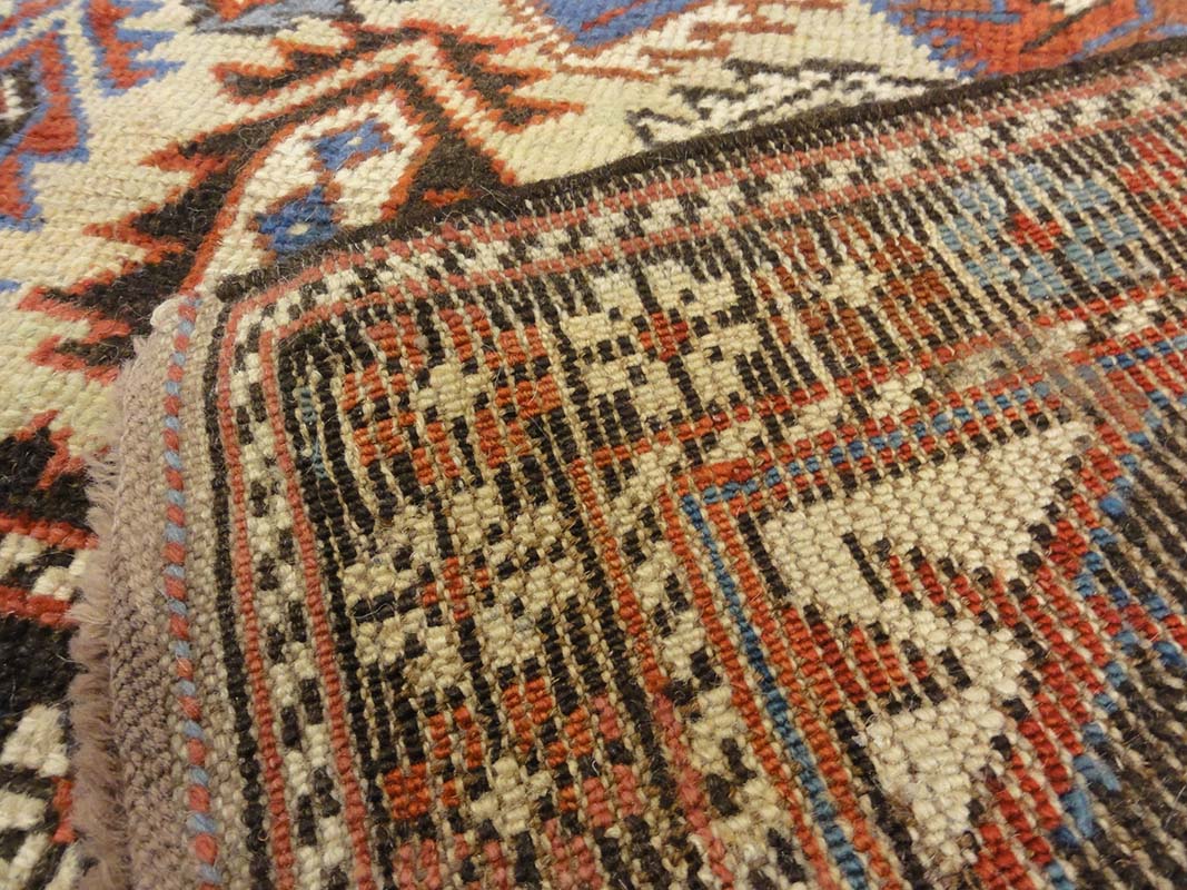 Antique Caucasian Shirvan Botteh Motif. Antique piece of woven carpet art sold by the Santa Barbara Design Center, Rugs and More in Santa Barbara, CA