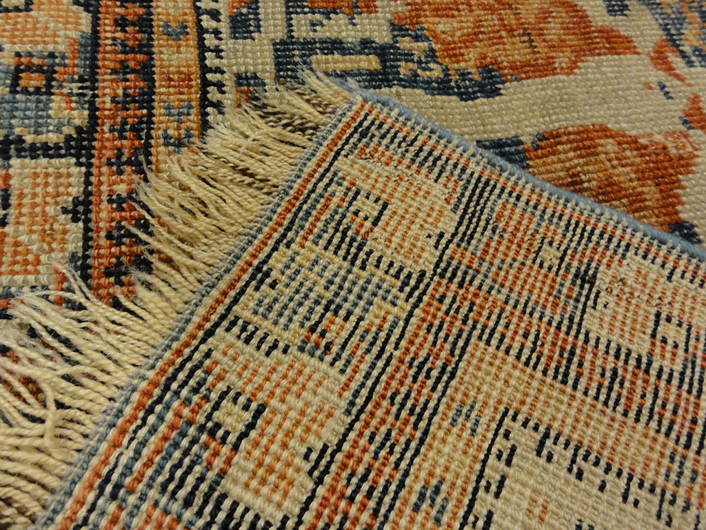 Antique Khamseh with Tribal Flowers. A piece of genuine woven carpet art sold at the Santa Barbara Design Center Rugs and More in Santa Barbara California.