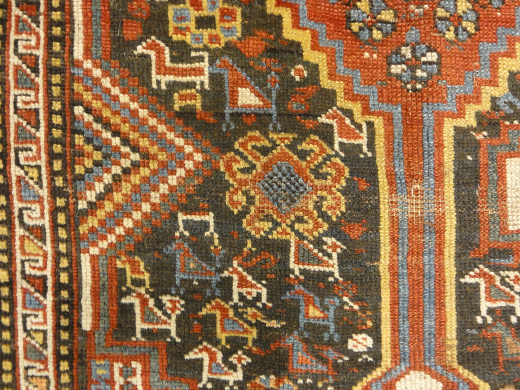 Antique Persian Khamseh Chicken Rug. A piece of genuine woven carpet art sold by Santa Barbara Design Center Rugs and More.