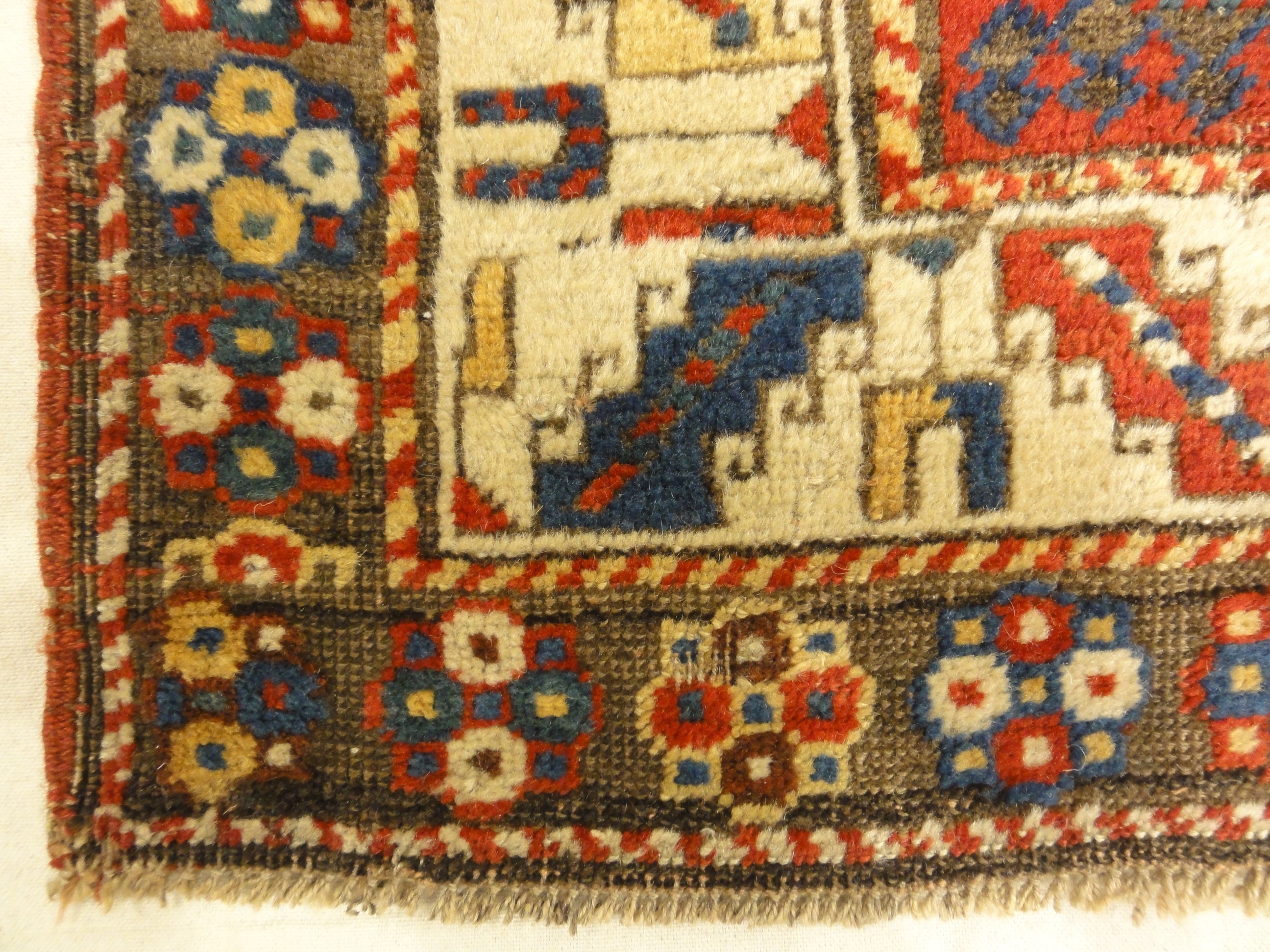 Caucasian Marriage Rug From 1880s. A piece of genuine antique woven carpet art sold by the Santa Barbara Design Center, Rugs and More.