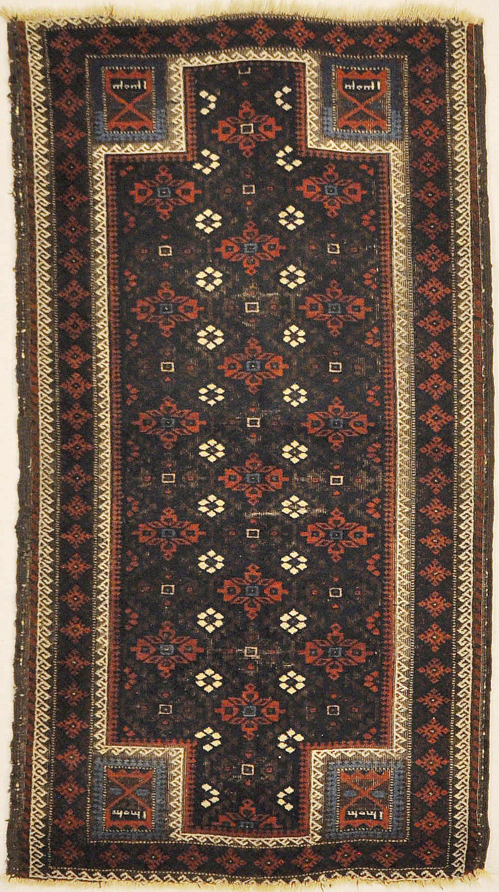 An antique and original burial Baluch dated rug. Dated on all four corners. Used as a casket covering. Sold by Santa Barbara Design Center.