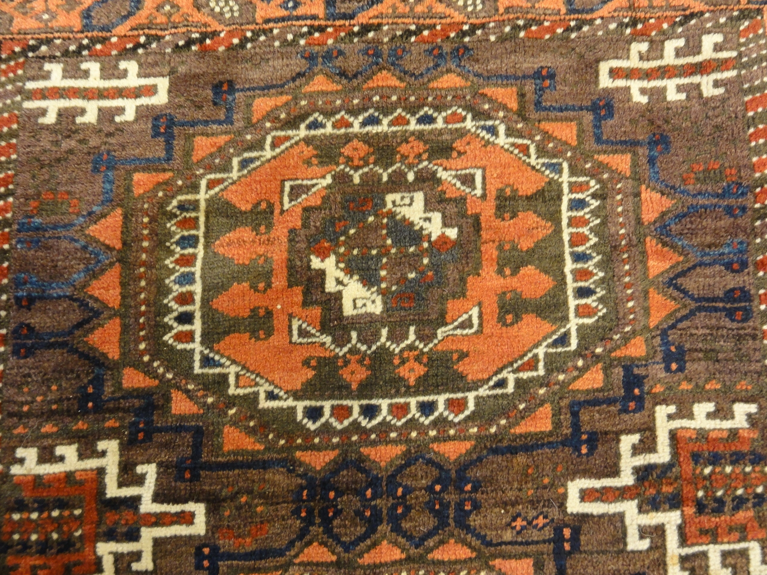 Antique Original Baluch with 3 Medallions and Unique Knotted Ends. An Afghan piece of original genuine woven carpet art sold by Santa Barbara Design Center.