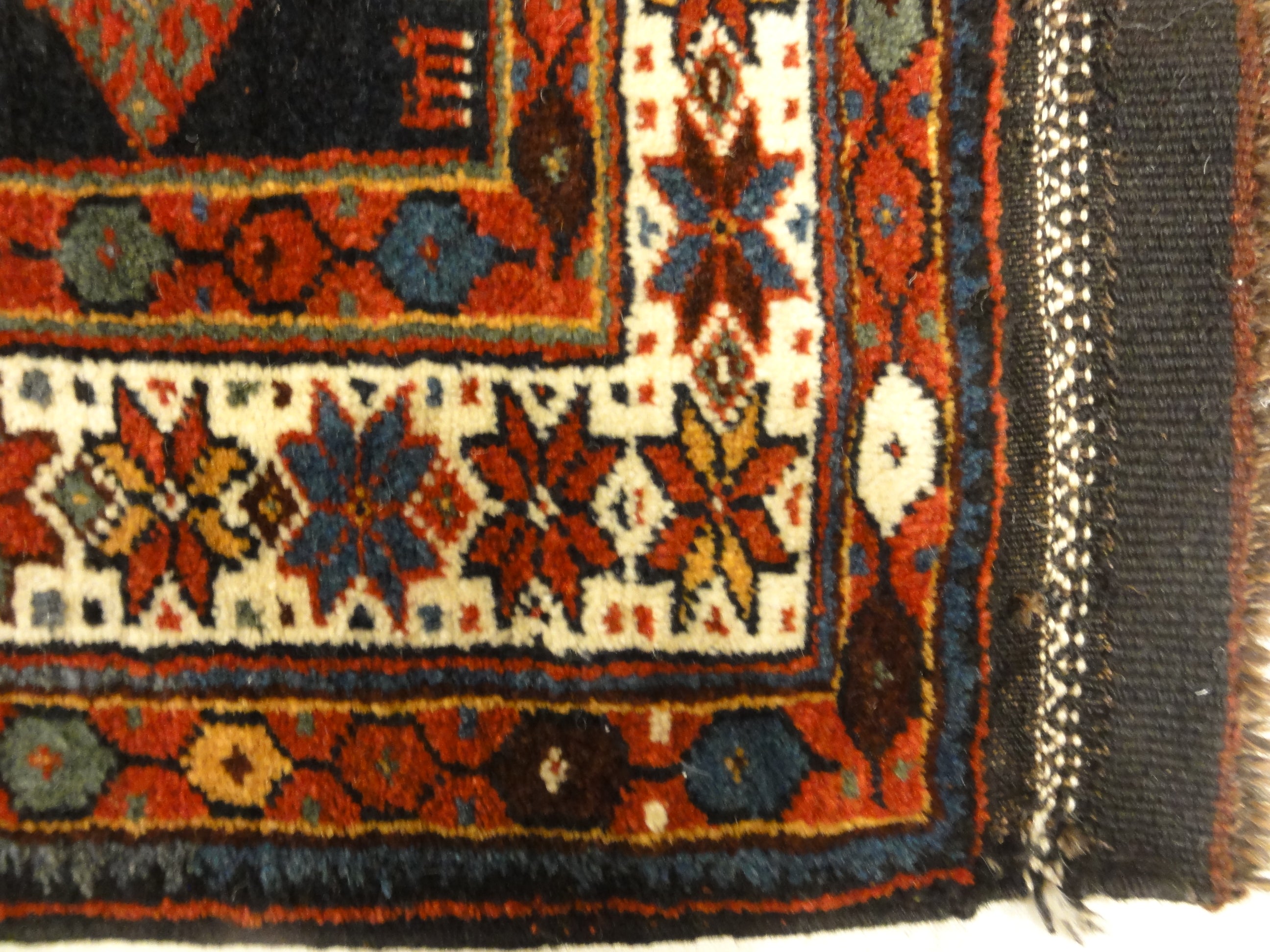 Kurdish Saddle Bag. A piece of genuine authentic antique woven carpet art sold by Santa Barbara Design Center, Rugs and More.