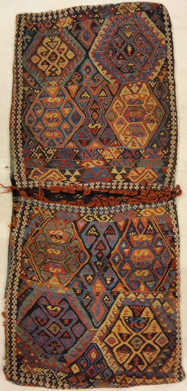 Small Bakhetiari Kelim Saddle Bag some metal threading throughout. Visit us Rugs & More in the Santa Barbara Design Center.