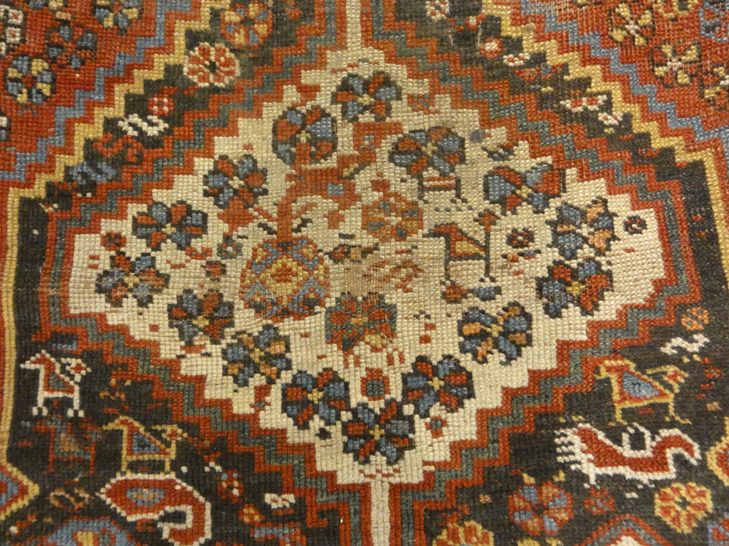 Antique Persian Khamseh Chicken Rug. A piece of genuine woven carpet art sold by Santa Barbara Design Center Rugs and More.