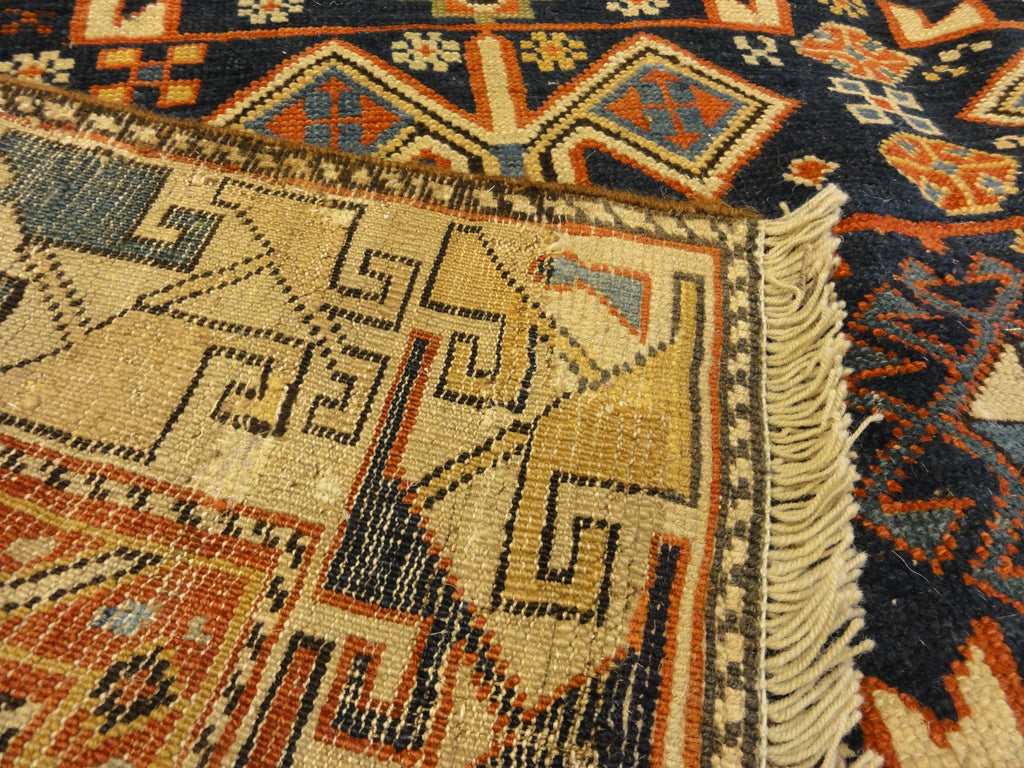 Antique Shirvan Rug Featuring Peacock and Two Men. A genuine authentic antique piece of woven carpet art sold by Santa Barbara Design Center, Rugs and More.