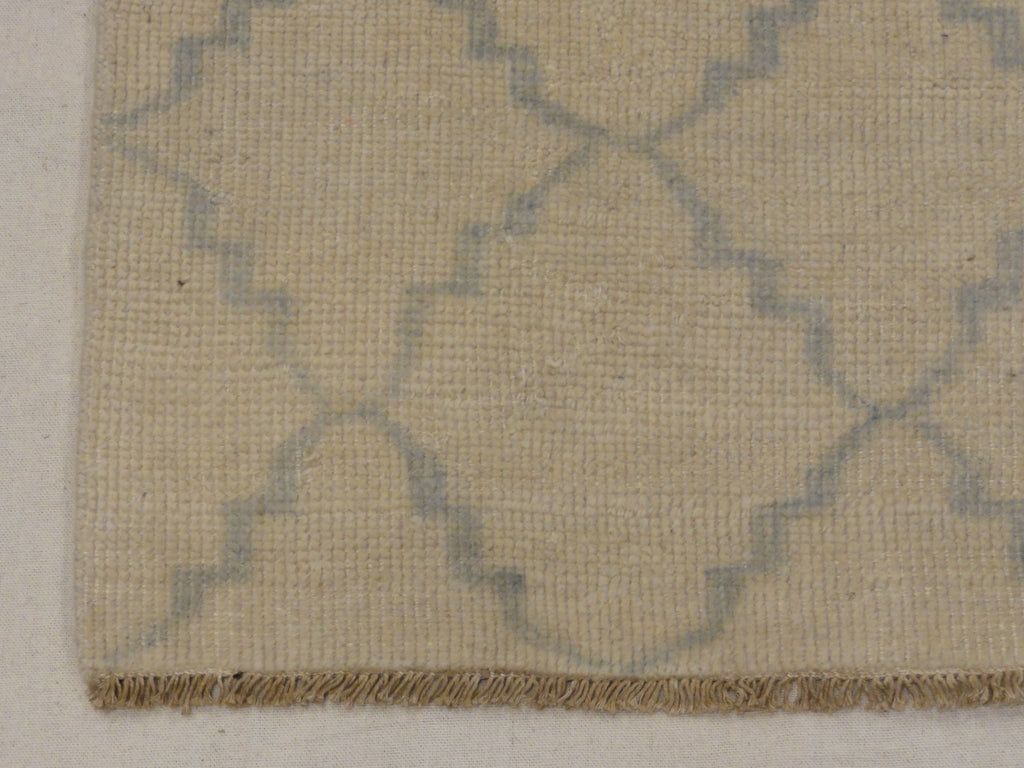 Blue and Beige Modern Trellised Rug. A piece of genuine woven carpet art sold by the Santa Barbara Design Center, Rugs and More.