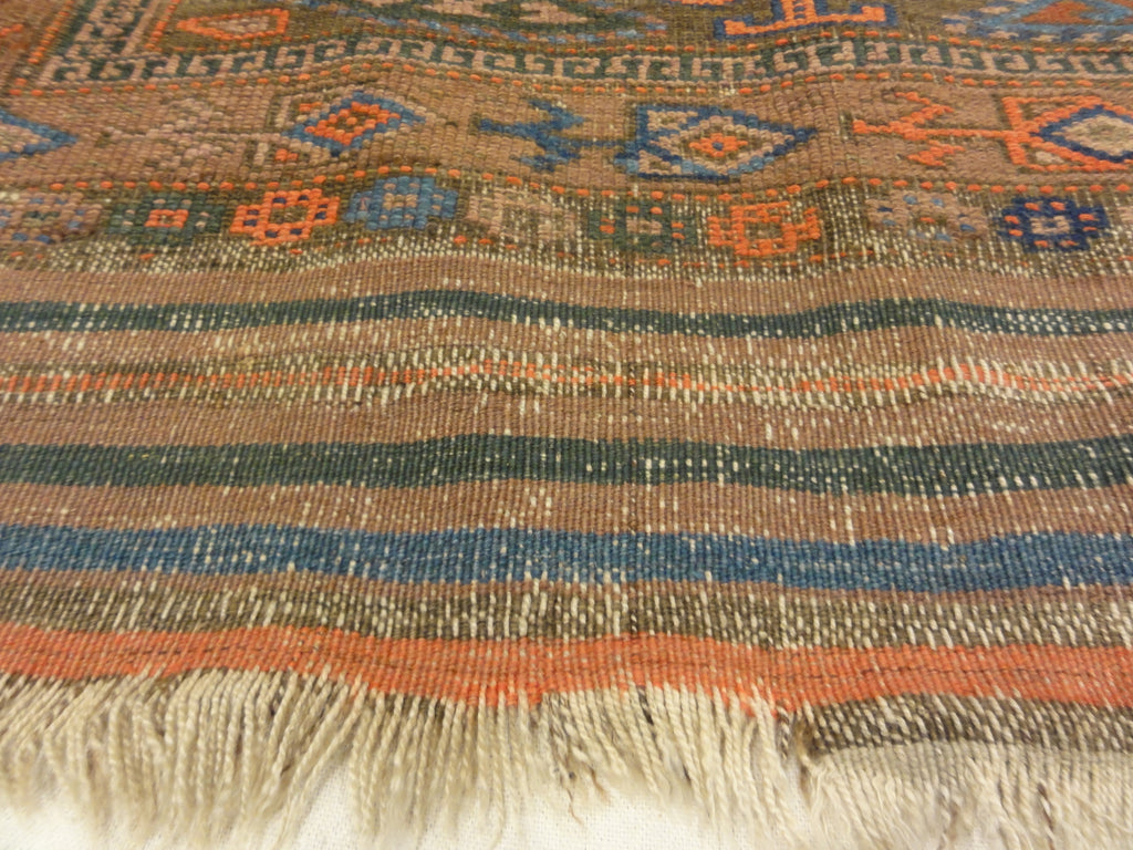 An antique original Mushwani Baluch rug handwoven in Afghanistan. A piece of genuine, authentic woven carpet art. Sold by Santa Barbara Design Center.