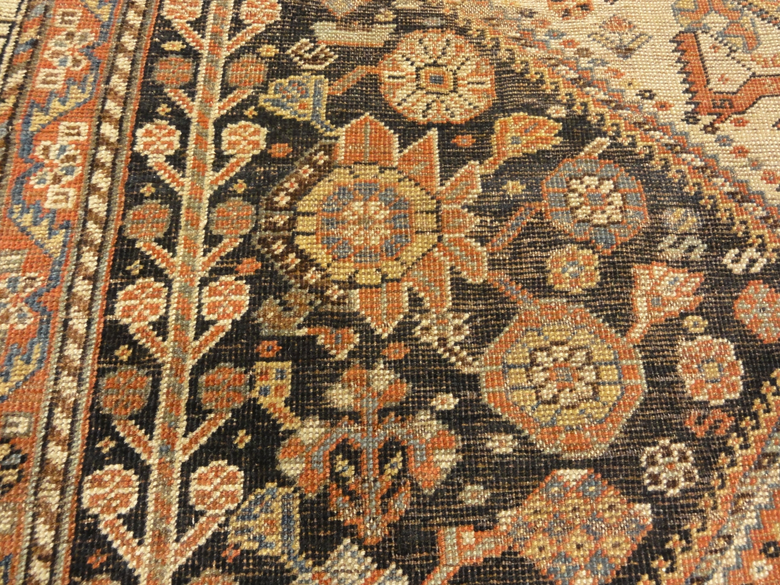 Antique Persian Qashqai featuring Tribal Flowers. A piece of genuine handwoven carpet art sold by Santa Barbara Design Center Rugs and More.