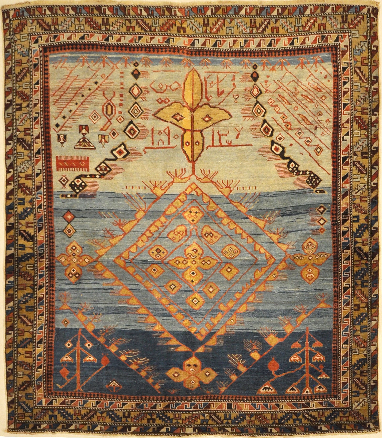 Best Caucasian Shirvan Prayer rug in the world RUGOHOLIC Rug. A piece of genuine authentic woven carpet art sold at Santa Barbara Design Center Rugs and More.
