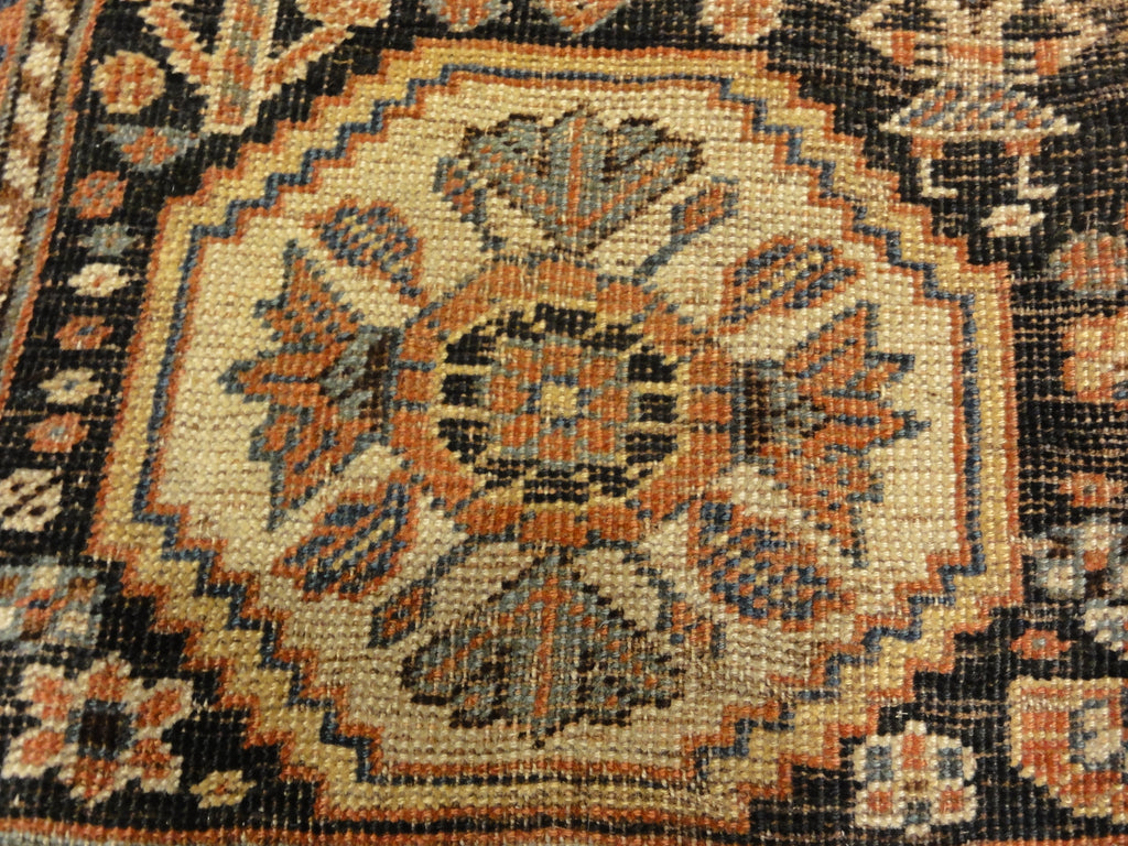 Antique Persian Qashqai featuring Tribal Flowers. A piece of genuine handwoven carpet art sold by Santa Barbara Design Center Rugs and More.