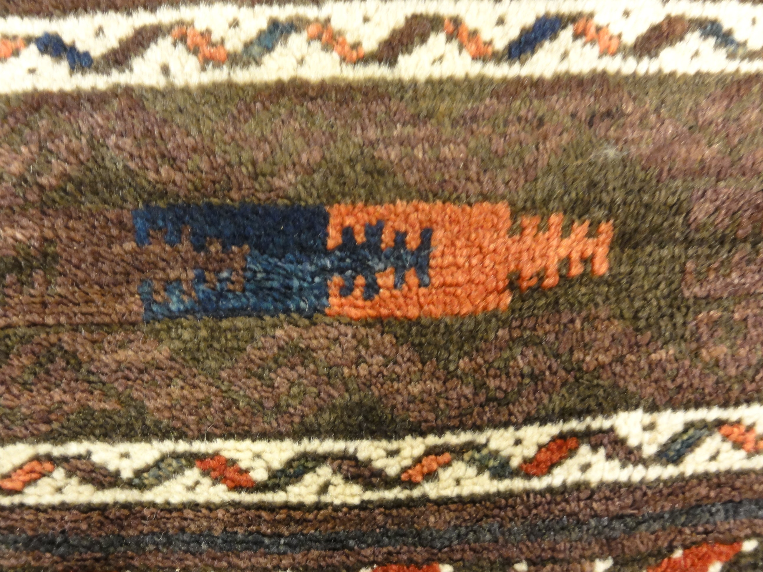 Antique Original Baluch with 3 Medallions and Unique Knotted Ends. An Afghan piece of original genuine woven carpet art sold by Santa Barbara Design Center.
