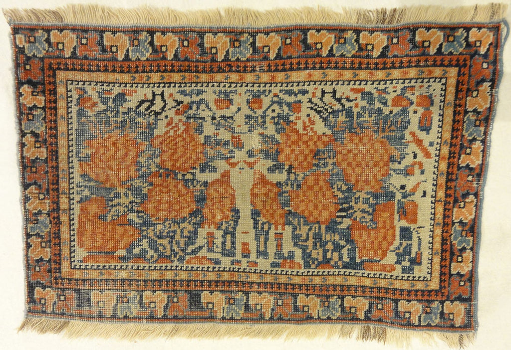 Antique Khamseh with Tribal Flowers. A piece of genuine woven carpet art sold at the Santa Barbara Design Center Rugs and More in Santa Barbara California.
