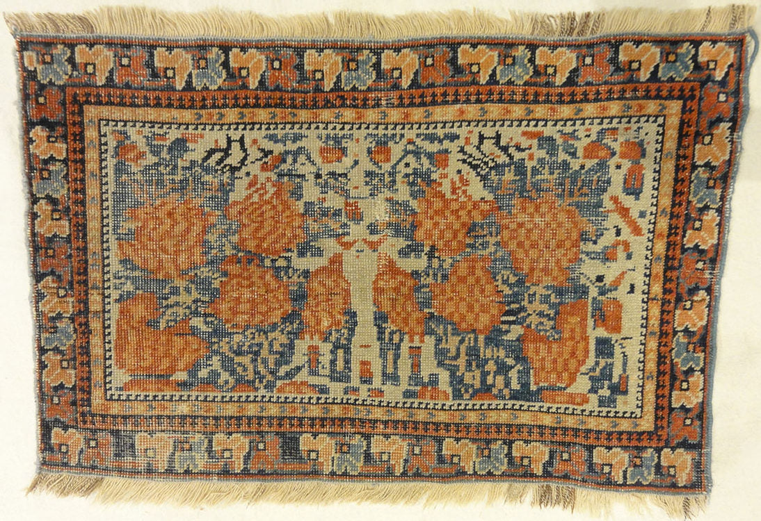Antique Khamseh with Tribal Flowers. A piece of genuine woven carpet art sold at the Santa Barbara Design Center Rugs and More in Santa Barbara California.