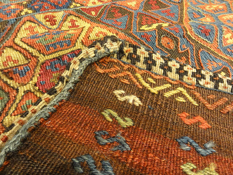 Small Bakhetiari Kelim Saddle Bag some metal threading throughout. Visit us Rugs & More in the Santa Barbara Design Center.