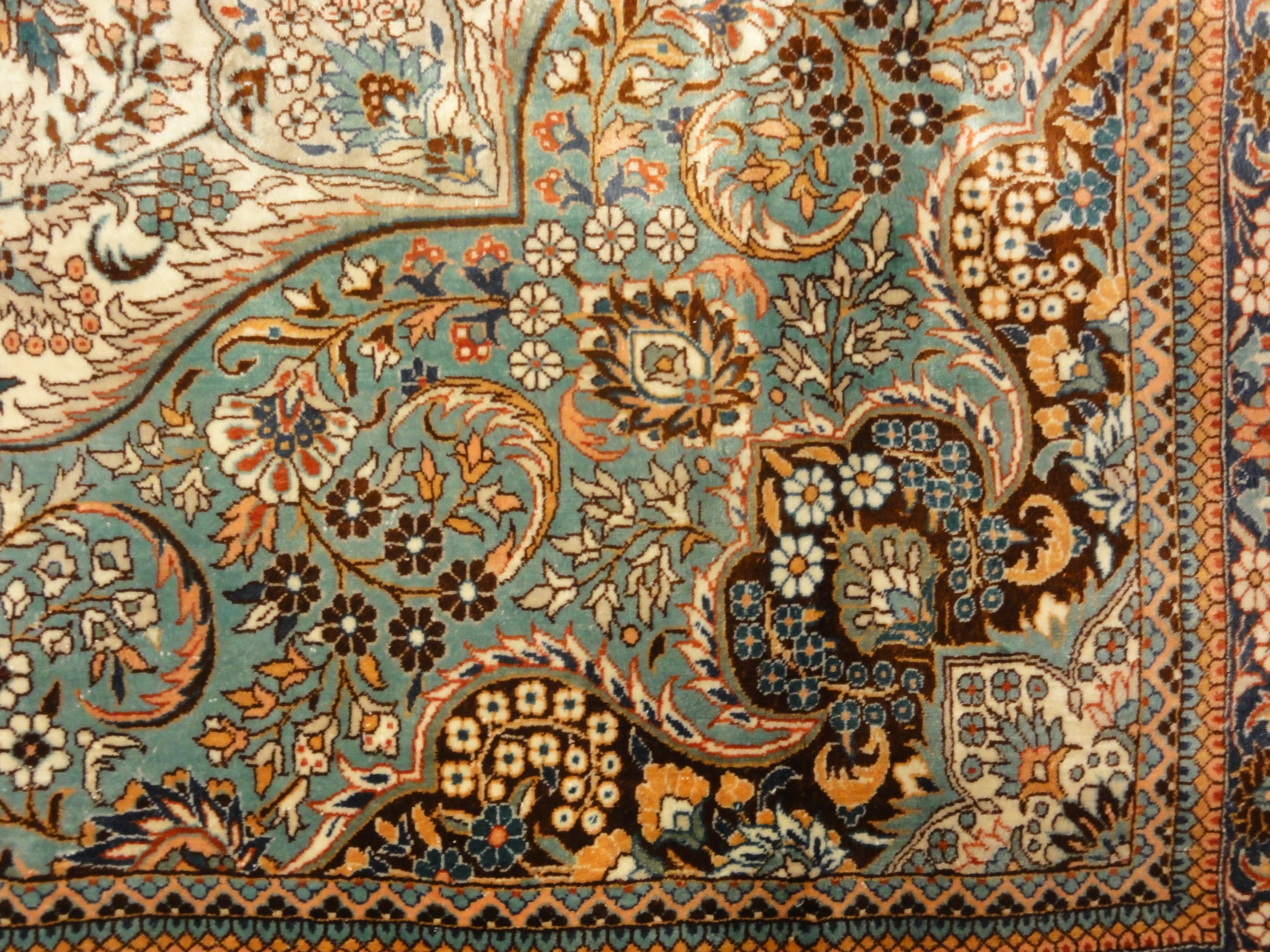 An antique finest silk rug featuring the garden of paradise with 1001 flowers. A piece of genuine woven carpet art sold at Santa Barbara Design Center.