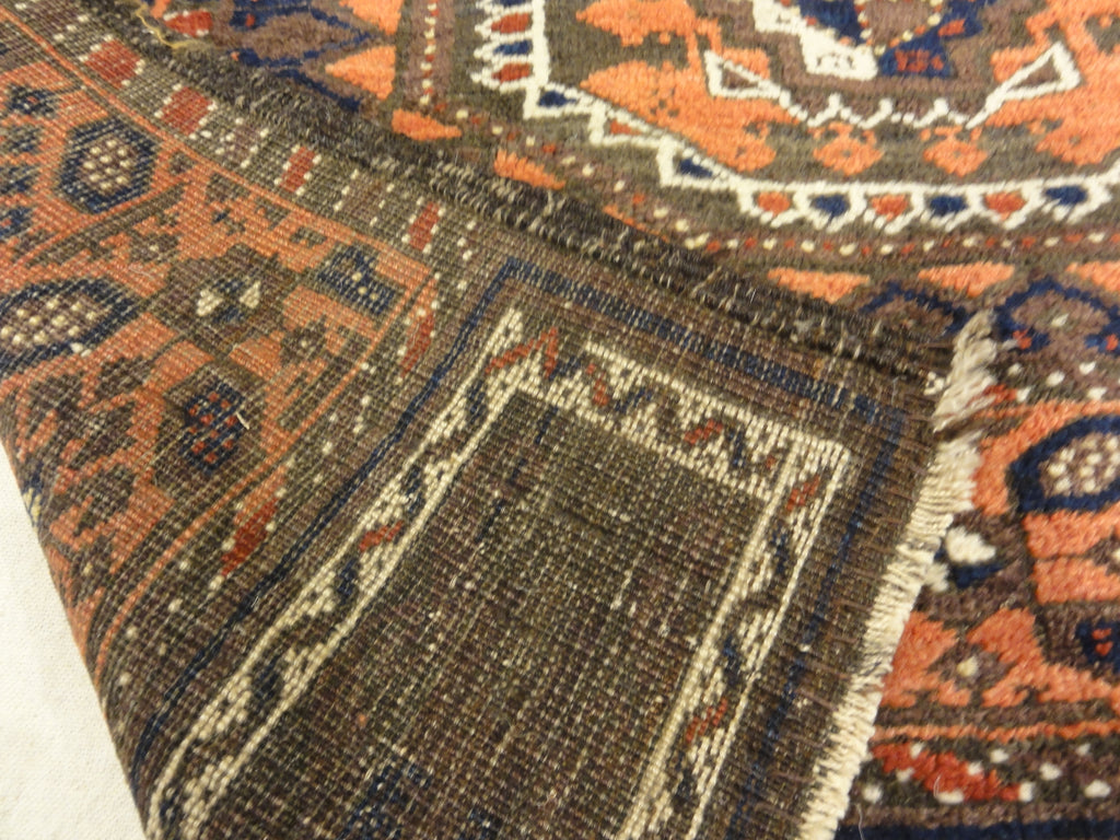 Antique Original Baluch with 3 Medallions and Unique Knotted Ends. An Afghan piece of original genuine woven carpet art sold by Santa Barbara Design Center.