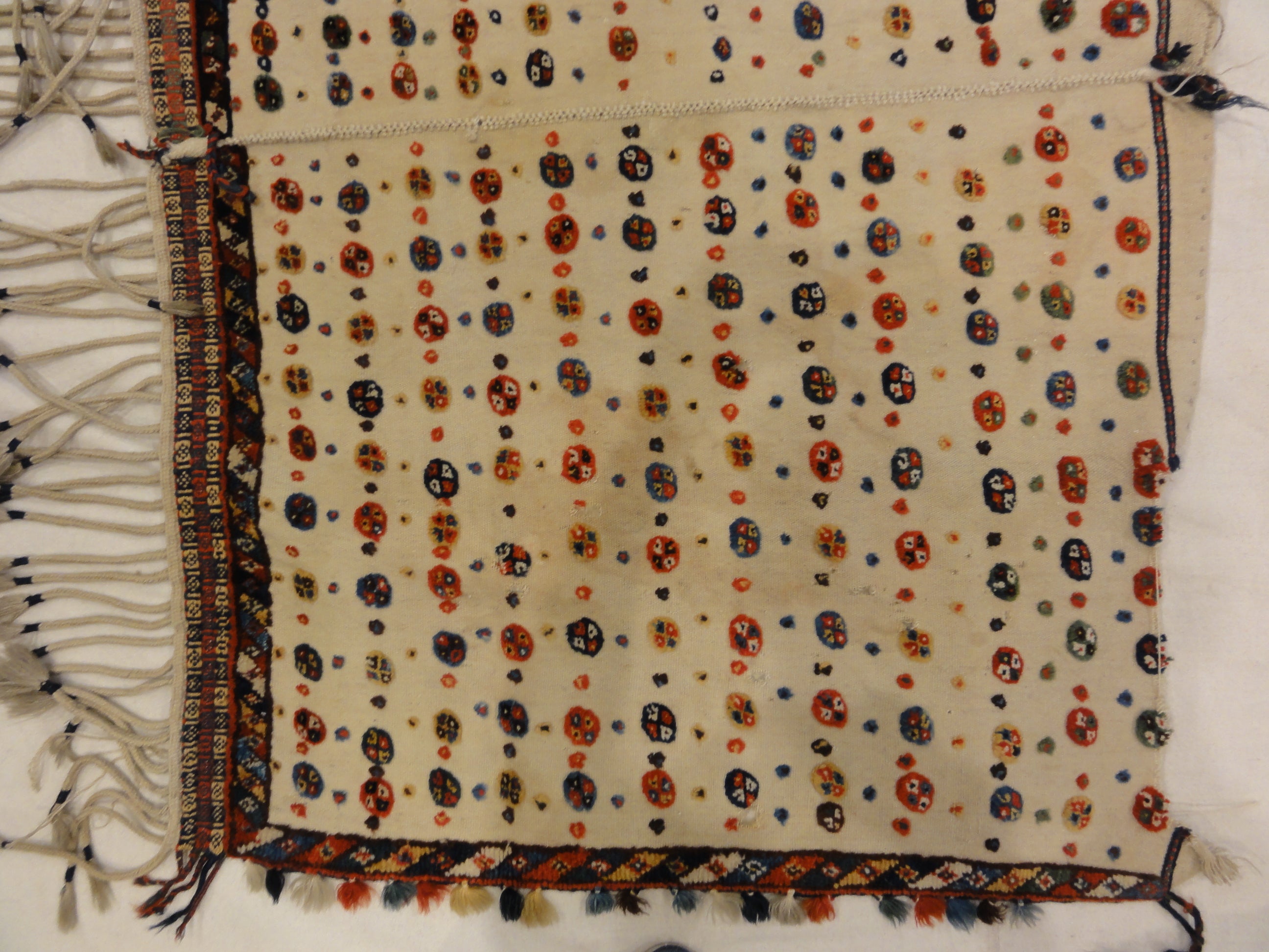 Antique Qashqai Saddle Cover. A piece of genuine authentic antique woven carpet art sold by the Santa Barbara Design Center Rugs and More.