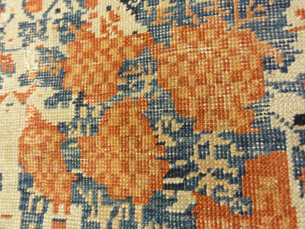 Antique Khamseh with Tribal Flowers. A piece of genuine woven carpet art sold at the Santa Barbara Design Center Rugs and More in Santa Barbara California.