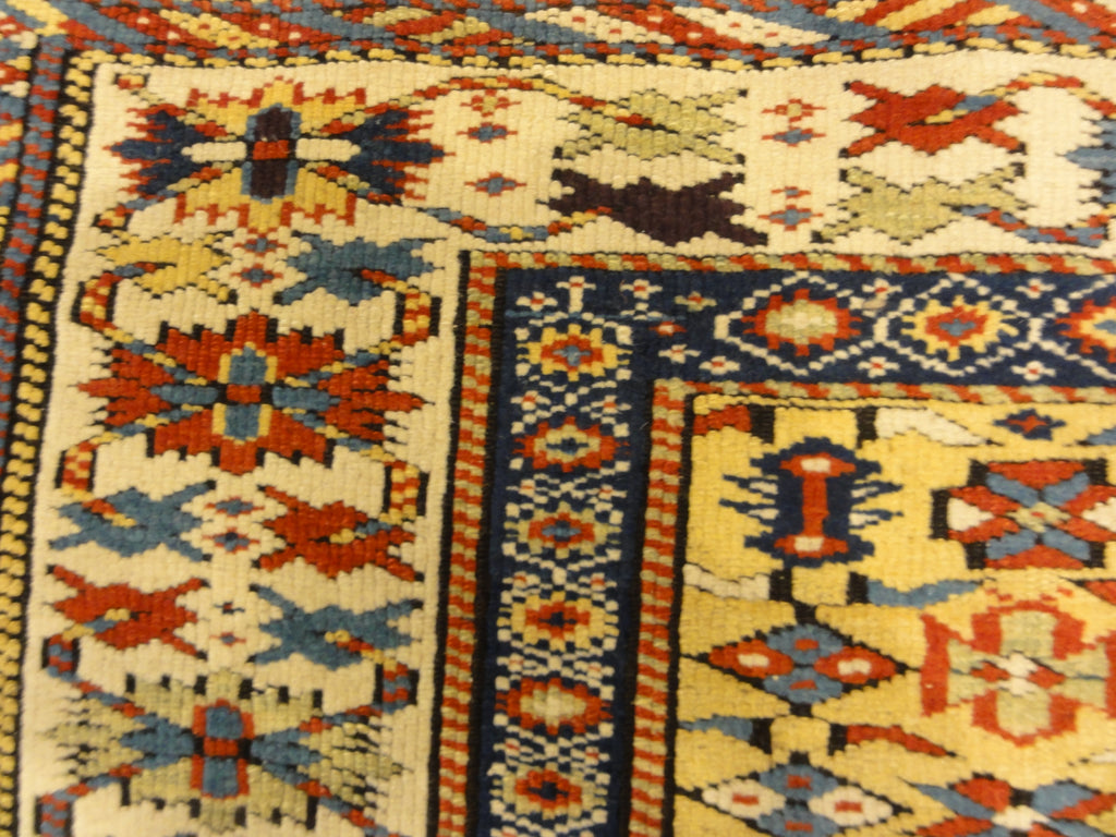 Antique Rare Gold Kuba Chichi Rug. A genuine authentic antique piece of carpet art sold by the Santa Barbara Design Center, Rugs and More.