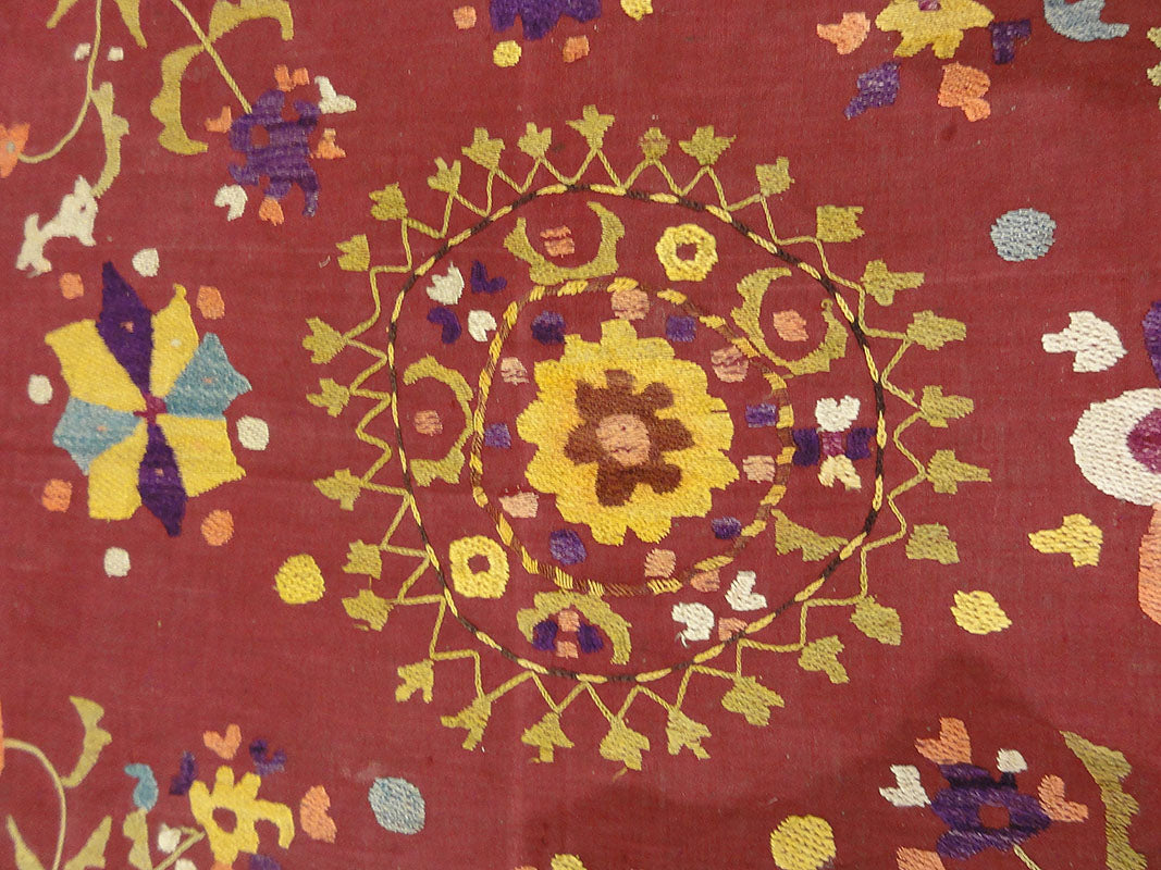 Antique Uzbek Turkestan Wool and Silk Suzani. A piece of wool and silk woven art sold by Santa Barbara Design Center Rugs and More in Santa Barbara CA.