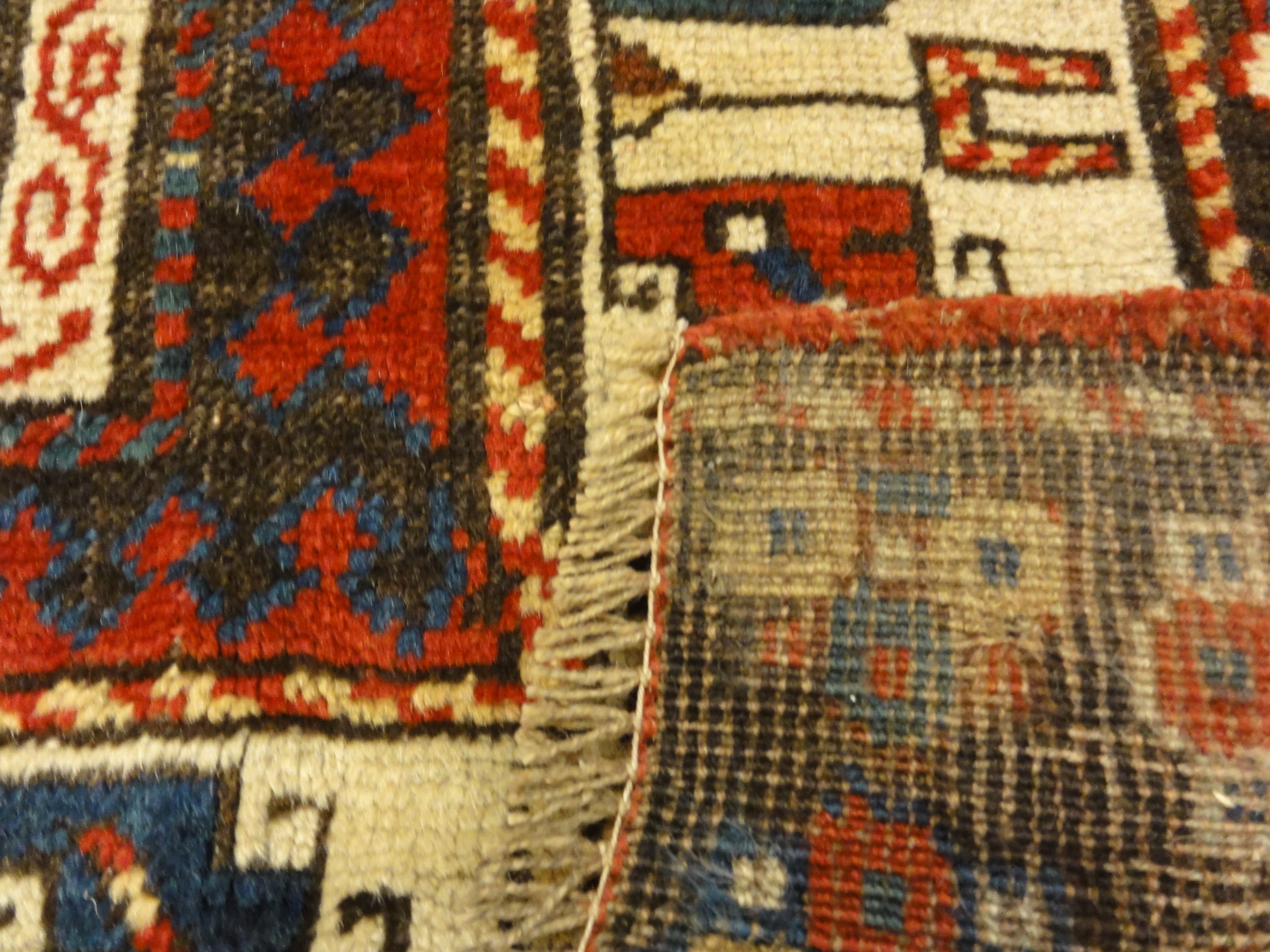Caucasian Marriage Rug From 1880s. A piece of genuine antique woven carpet art sold by the Santa Barbara Design Center, Rugs and More.