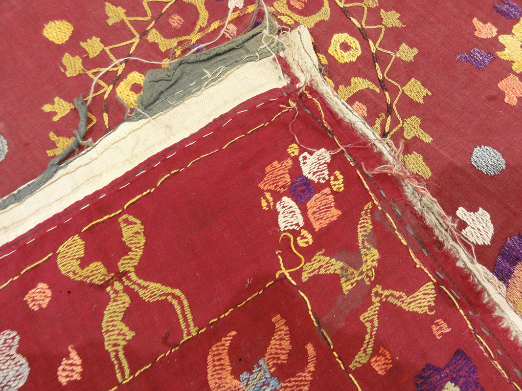 Antique Uzbek Turkestan Wool and Silk Suzani. A piece of wool and silk woven art sold by Santa Barbara Design Center Rugs and More in Santa Barbara CA.